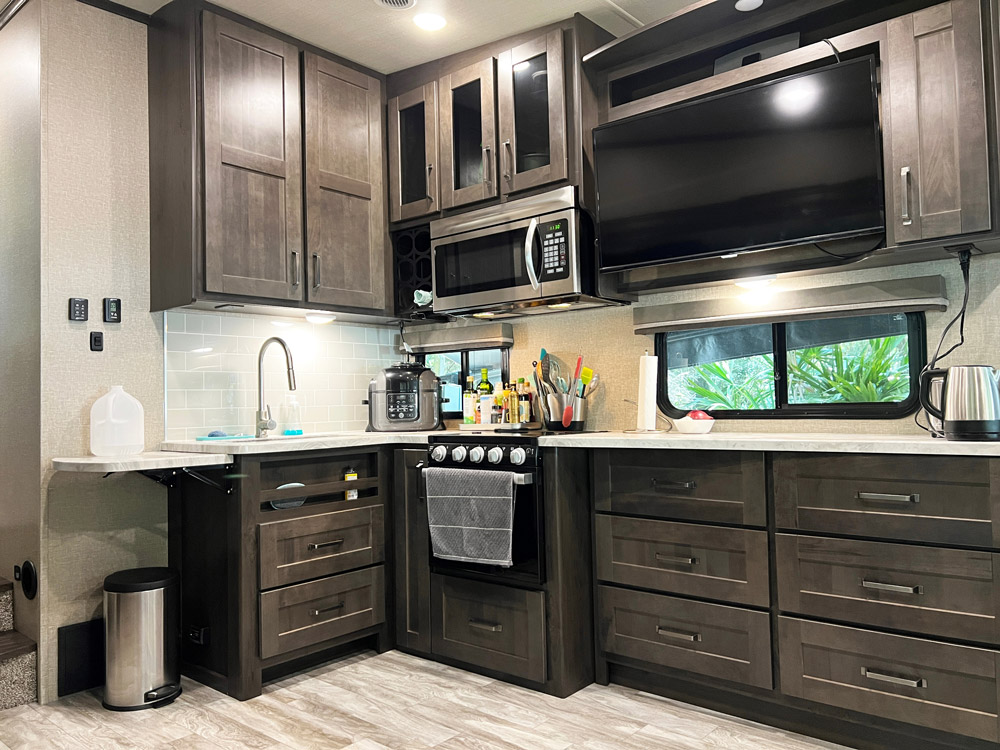 An RV kitchen that has implemented great camper storage ideas