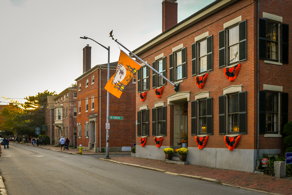 A Halloween flag flies outside a historical building in Salem, Massachusetts