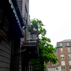 The sign outside the Witch Dungeon, one of the spots to see when you RV in Salem in October