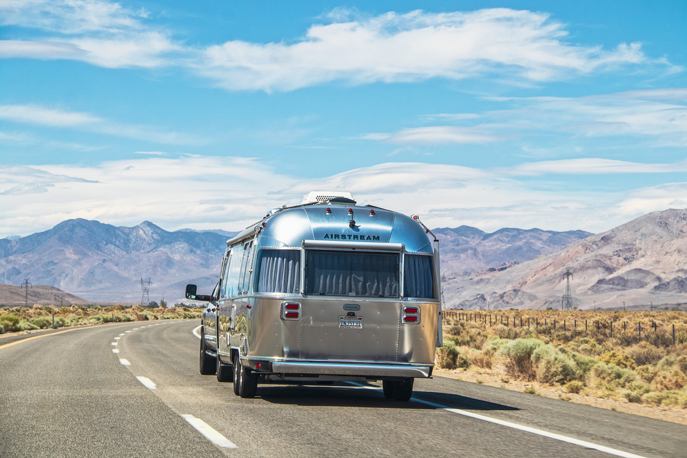 Airstream RV traveling down the road