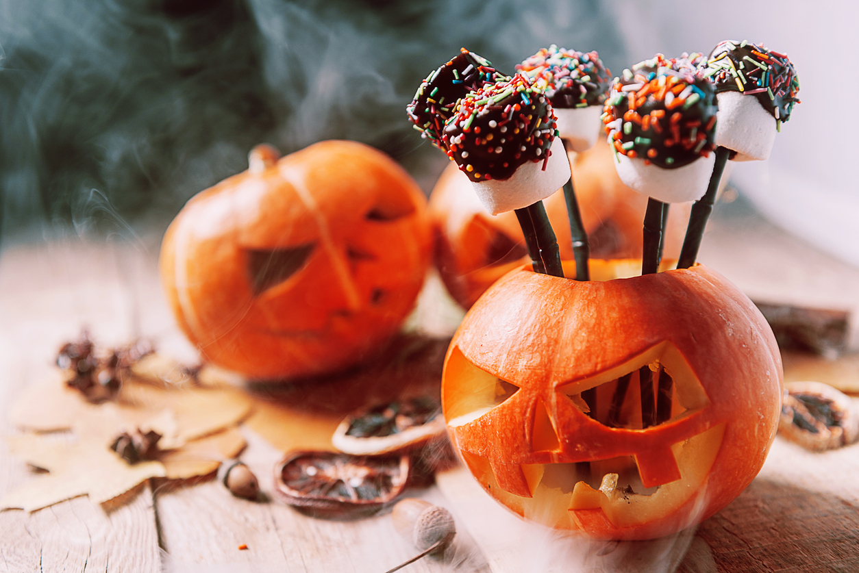 Mini jack-o-lanterns with chocolate covered marshmallows sticking out. You could make these to celebrate Halloween in Your RV