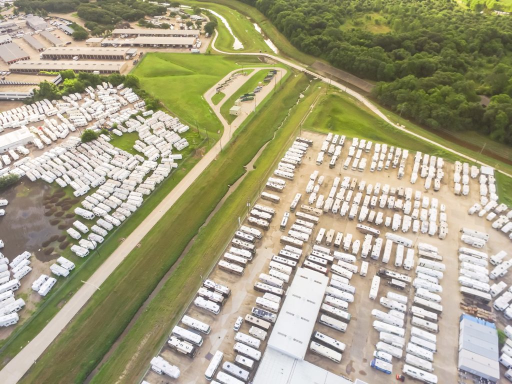 Save Money on a New RV: An overhead shot of a massive dealership with new RVs