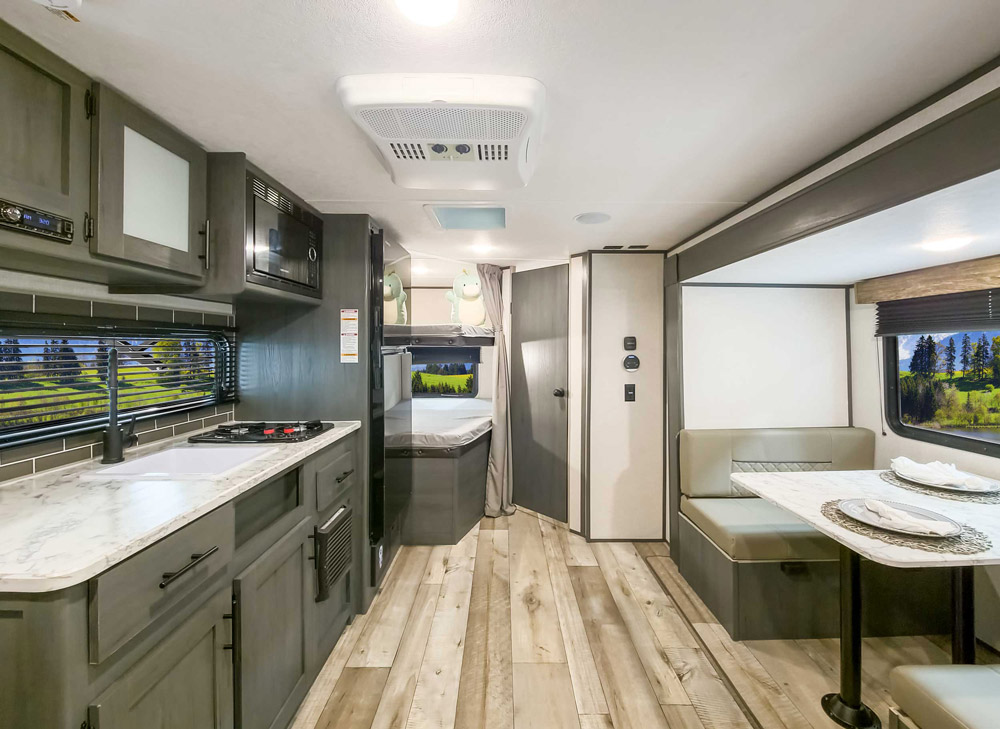 The interior of a Dutchmen Aspen Trail, with plenty of overhead room to make it one of the best RVs for tall people