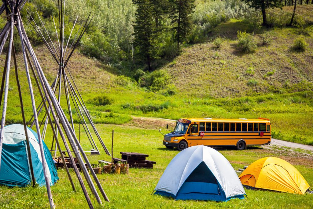 Skoolie camper at a campsite