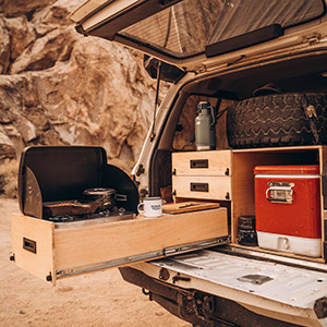 Slideout drawers on an overland classifieds truck in the desert