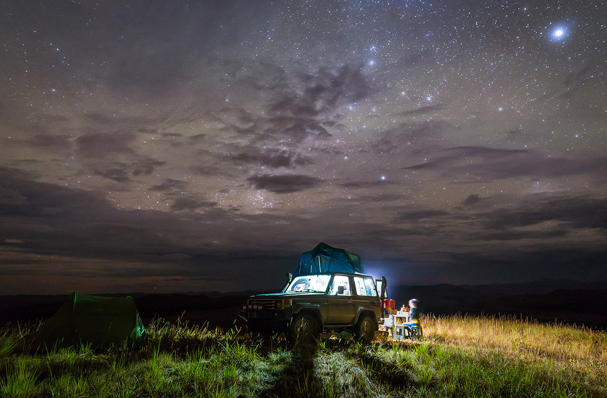 An overland truck camps at night. These vehicles are part of RVUSA's new overland classifieds category