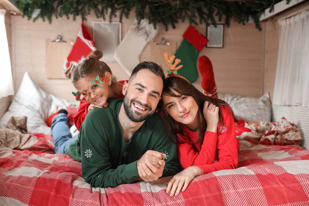 Happy family in RV motorhome on Christmas eve
