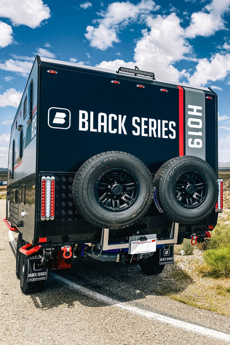 The rear of a Black Series Camper HQ19, one of the overland trailers for sale on RVUSA
