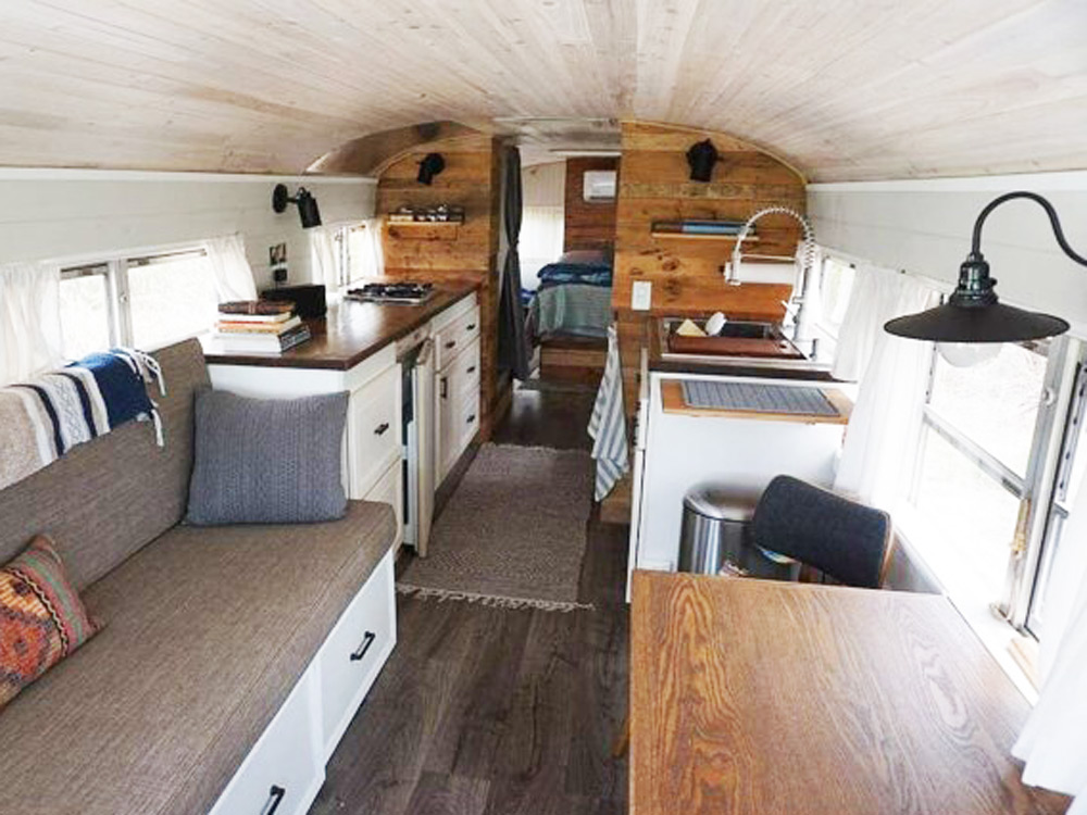 The living space of a renovated school bus for sale