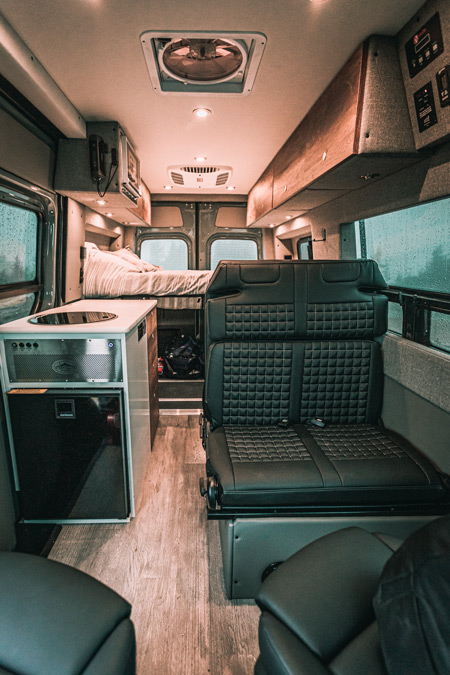 The living space inside a Storyteller Overland Stealth MODE adventure van