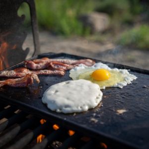 Eggs and bacon over the campfire is one of the easiest camping breakfast ideas
