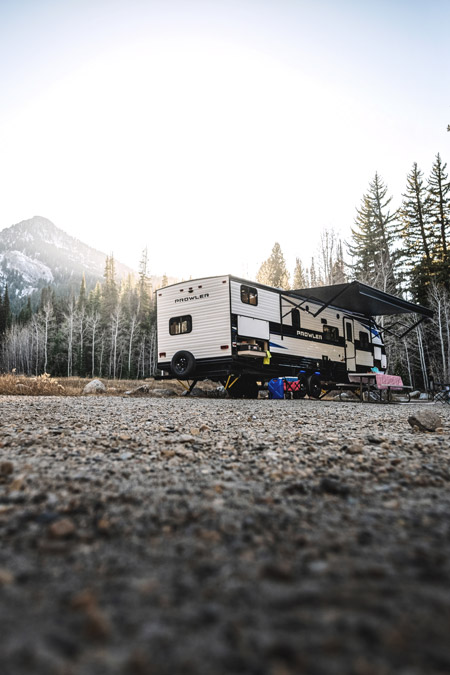 One of the top 10 most viewed RVs on RVUSA is a Heartland Prowler - this one sits in front of a mountain range with the sun behind it