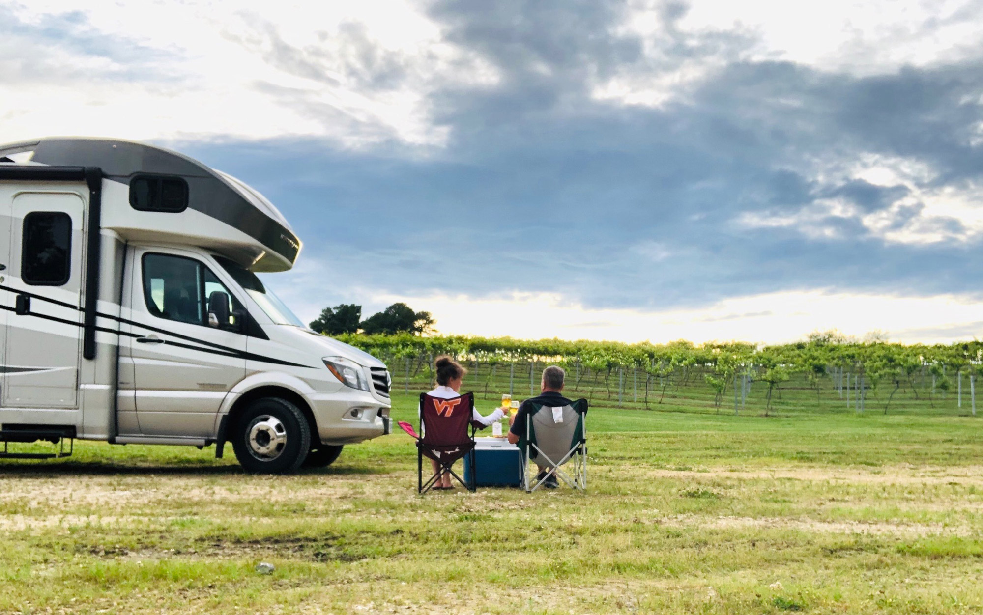A couple enjoys RV camping at wineries and farms in their Class C RV