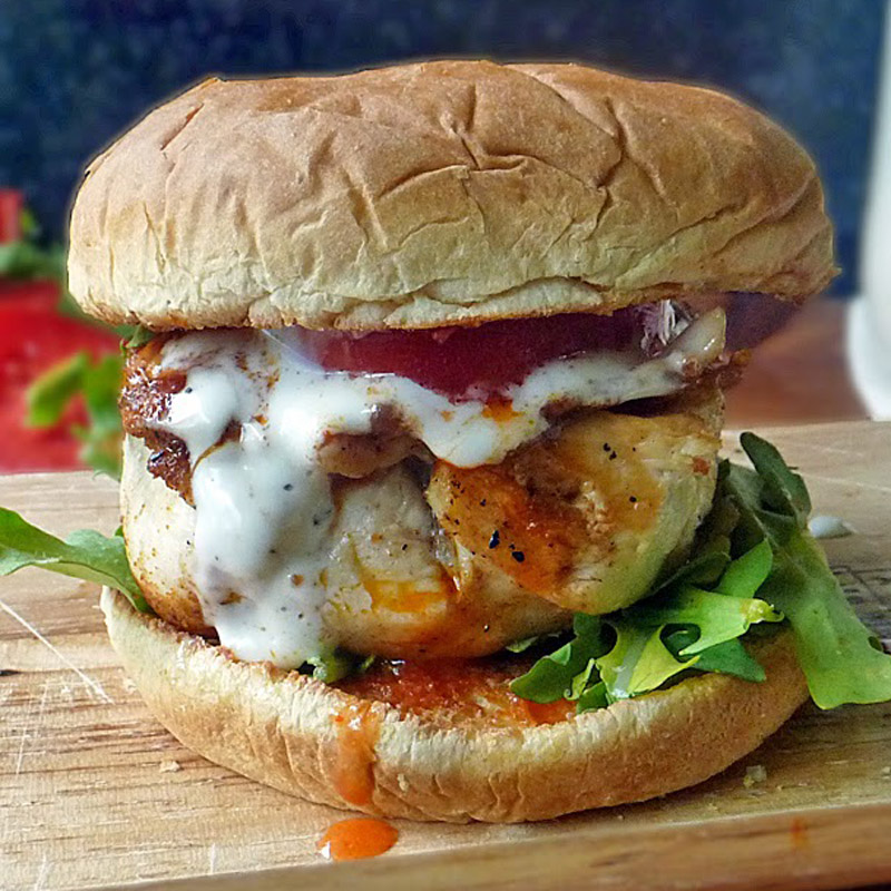 A grilled buffalo chicken sandwich with creamy ranch sauce. This tops our list of RV tailgating recipes