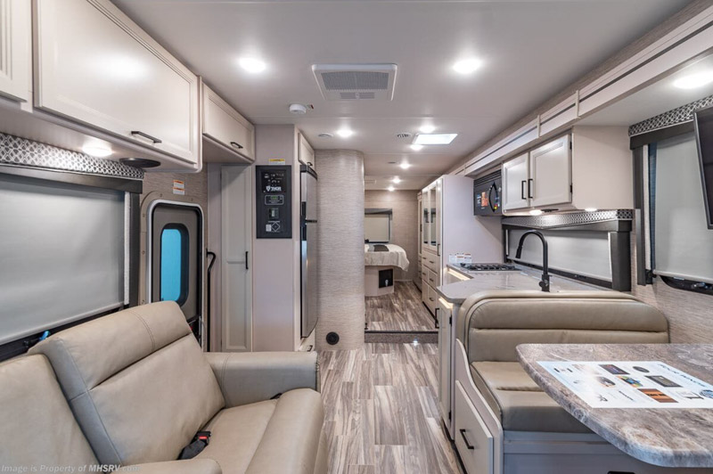One of the best RVs for 2023 is a Thor Motor Coach Four Winds. This view is of the living area in the interior.