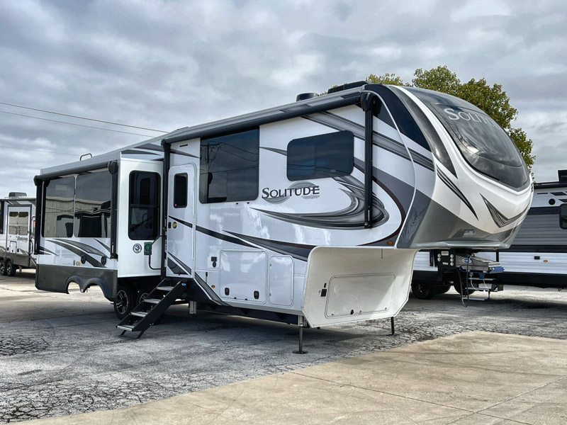 One of the best 2023 RV models, a Grand Design Solitude, on an RV lot