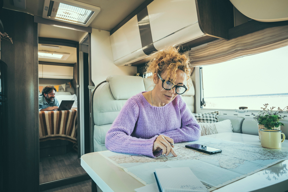 Woman planning route with RV GPS Apps.
