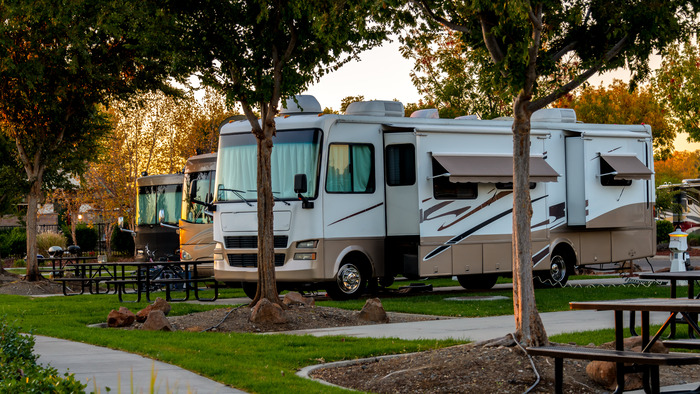 RVs side by side in RV Park. Choose one of our favorite RV campgrounds for Thanksgiving for a holiday like this.