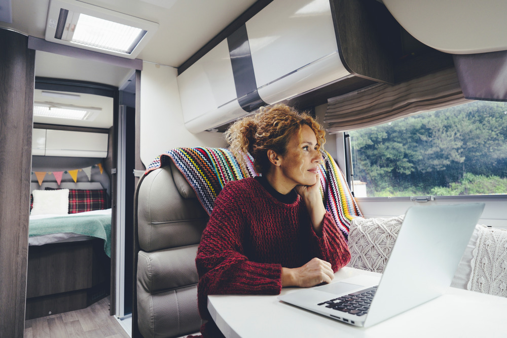 Woman on computer inside RV