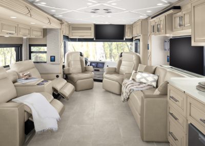 Staged living area and captain's chairs in a Newmar Mountain Aire.